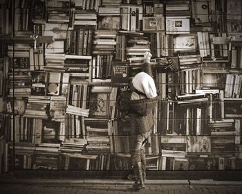 Rear view of a man walking in city