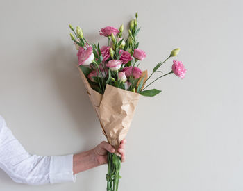 Close-up of hand holding bouquet