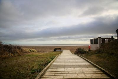 Pier over sea against sky