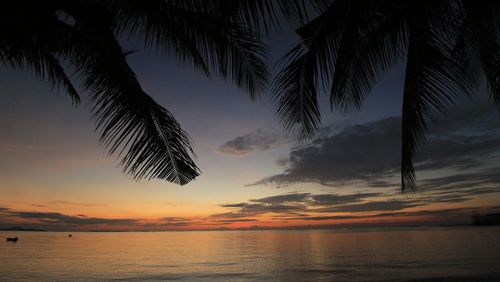 Scenic view of sea against sky at sunset