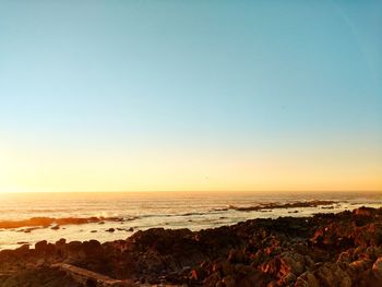 View of beach at sunset