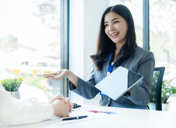 Portrait of young businesswoman working at office