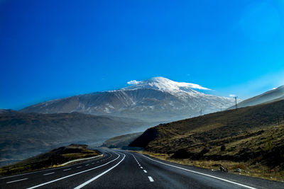 Road leading towards mountains