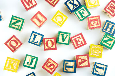 Multi colored toy blocks on white background