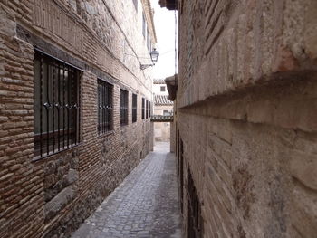 Alley amidst buildings in city