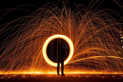 Low angle view of light painting at night