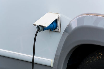 Close-up of electric car being charged