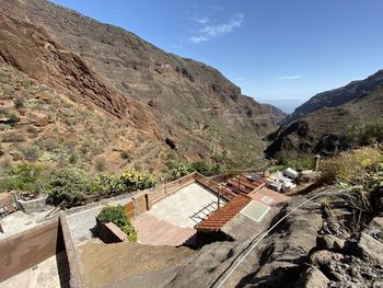High angle view of houses and mountains against sky