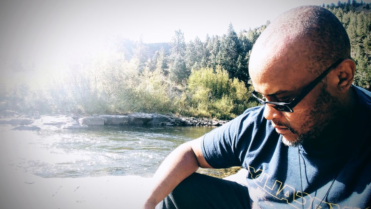 water, one person, day, nature, real people, glasses, men, tree, lifestyles, headshot, portrait, males, leisure activity, sunlight, mature men, river, adult, mature adult, outdoors