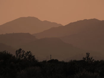 Scenic view of mountains at sunset