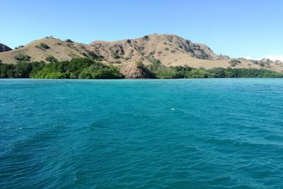 Scenic view of sea against clear blue sky