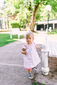 Full length of cute girl standing outdoors