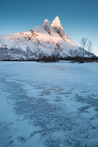 Scenic view of snowcapped mountain against sky