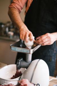 Midsection of man preparing food