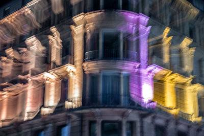 Low angle view of illuminated building at night