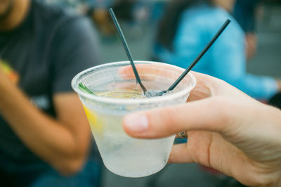 Close-up of hand holding drink