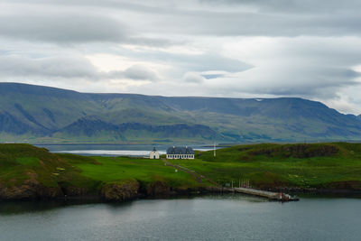 Scenic view of lake and mountains against sky