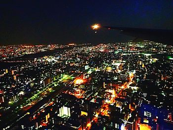 Low angle view of illuminated cityscape