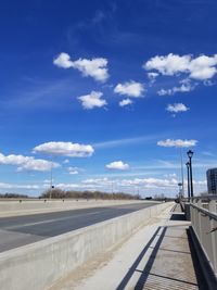 Empty road against sky