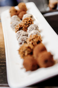 Close-up of chocolate truffles in tray