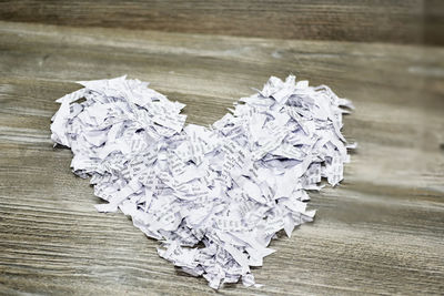 Close-up of paper stack on wooden table