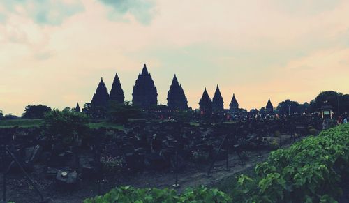 Silhouette of temple against sky at sunset