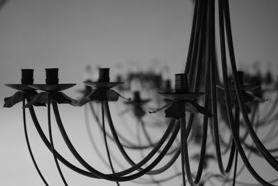 Close-up of telephone pole against sky