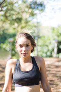 Portrait of teenage girl sitting in park