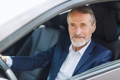 Portrait of man in car