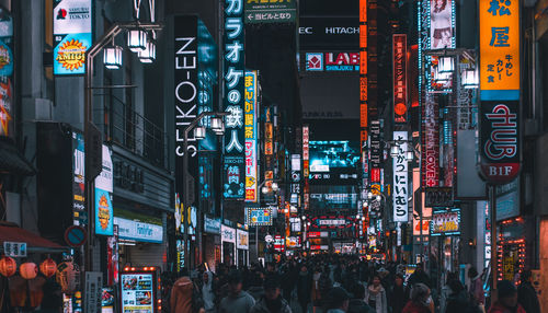 Crowd on city street at night