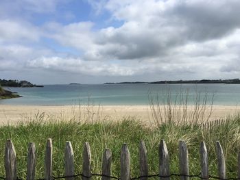 Scenic view of sea against cloudy sky