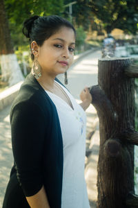 Side view of young woman looking away