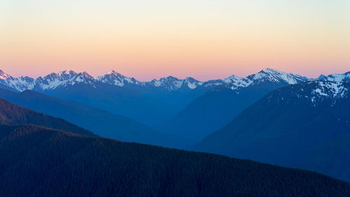 Calm, dreamy, pink summer sunset over olympic national park