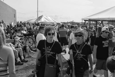 People on street against sky