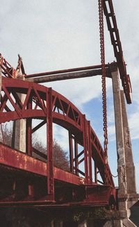 Low angle view of metal structure against sky