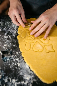 Cropped hand of person preparing food