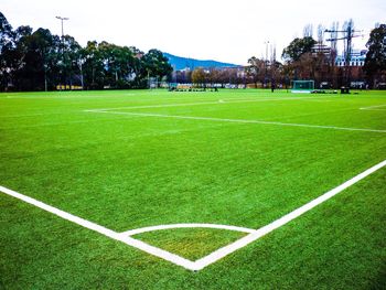 Scenic view of soccer field against sky