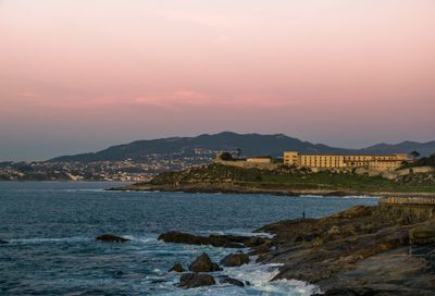 Sunset views in baiona with famous castle hotel and nigran in the background