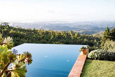 Infinity pool against landscape