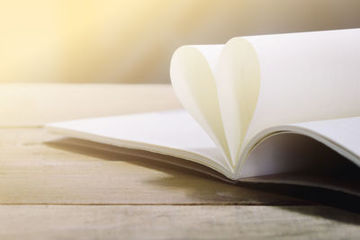 Close-up of heart shape on book