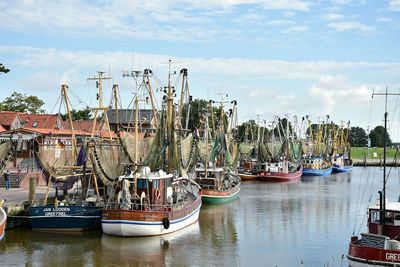 Boats in sea with city in background