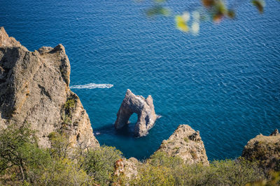 High angle view of rock formation in sea