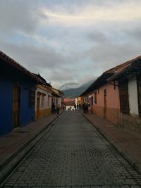 Cobblestone street against sky