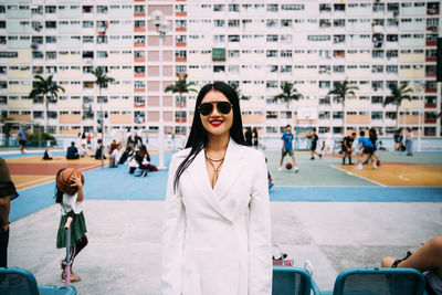 Woman standing on street in city