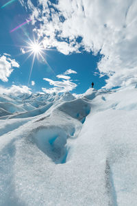 Scenic view of snow covered landscape against sky