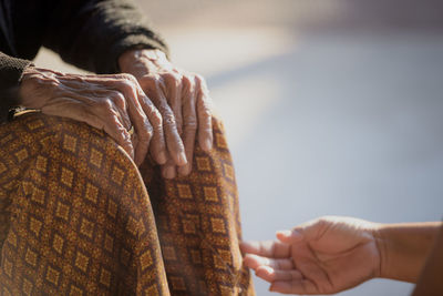 Close-up of man holding hands