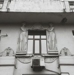 Low angle view of statue against building