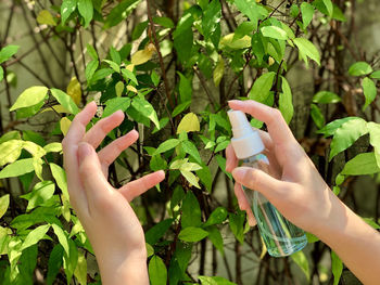 Spray alcohol on hand for personal safety and to prevent germs, disease , viruses.