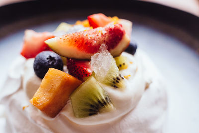 Close-up of fruits on ice cream in plate