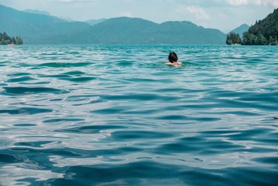 Woman swimming in sea